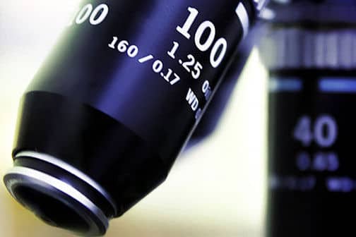 Close up of a microscope viewing lens.