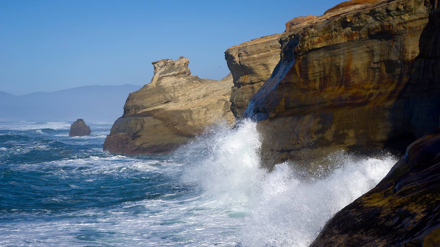 Waves bouncing off cliffs.